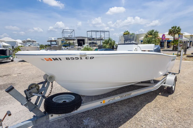 Slide: The Image of 2015 Sportsman Island Reef 17 Center Console boat on trailer, parked outdoors. - 12