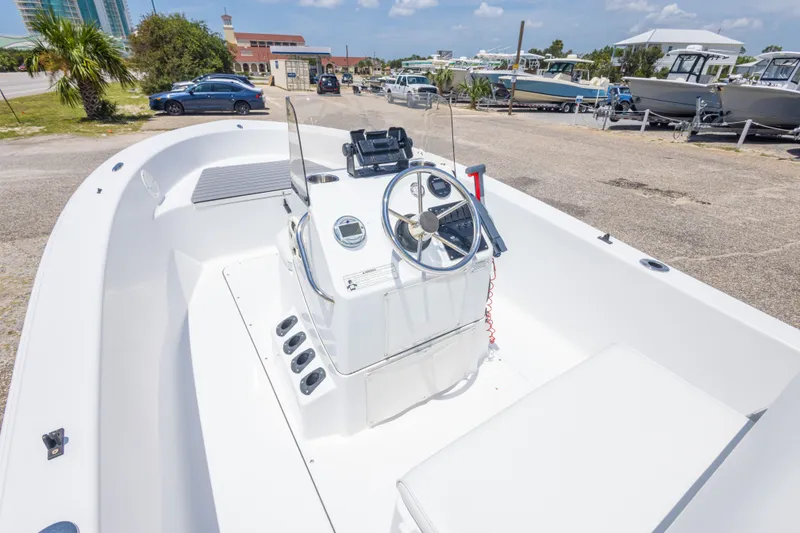Slide: The Image of 2015 Sportsman Island Reef 17 Center Console boat interior at a marina. - 19