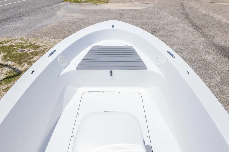 Slide: The Image of 2015 Sportsman Island Reef 17 Center Console boat interior, featuring a clean, spacious deck. - 23
