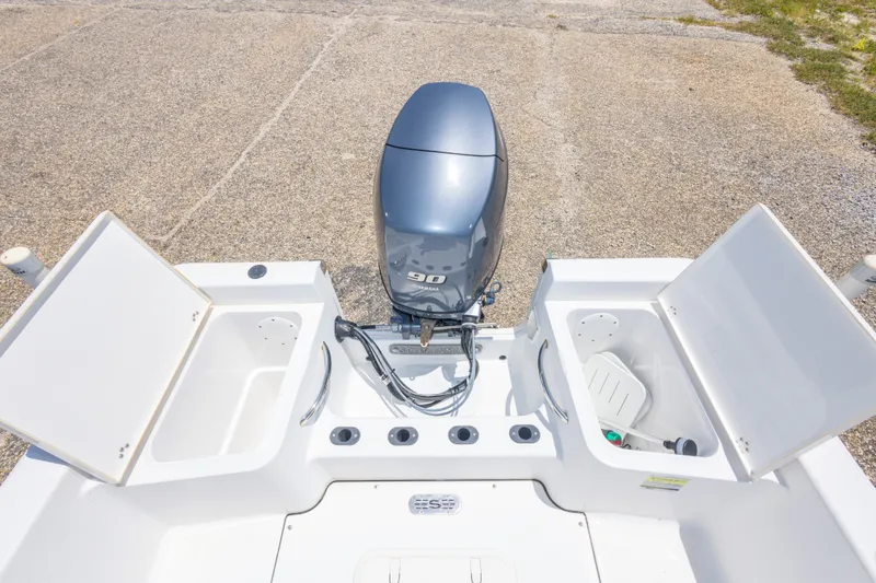 Slide: The Image of 2015 Sportsman Island Reef 17 Center Console with Yamaha 90 engine, open storage compartments. - 32