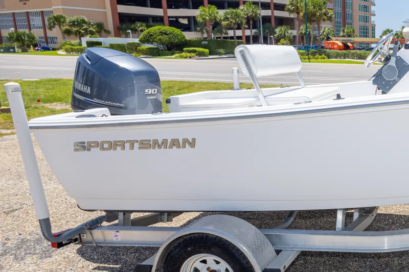 Slide: The Image of 2015 Sportsman Island Reef 17 Center Console boat on trailer, featuring Yamaha 90 engine. - 34