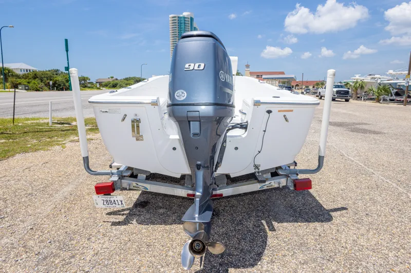 Slide: The Image of 2015 Sportsman Island Reef 17 Center Console boat on trailer, featuring Yamaha 90 engine. - 15