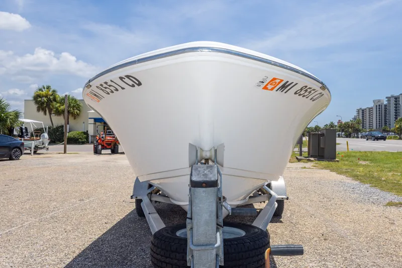 Slide: The Image of 2015 Sportsman Island Reef 17 Center Console boat on trailer, parked outdoors. - 13