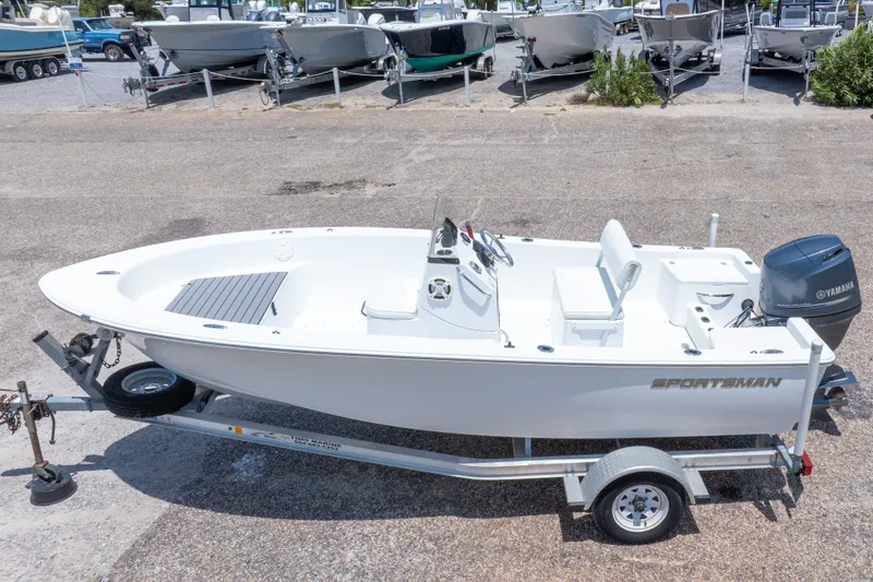 Slide: The Image of 2015 Sportsman Island Reef 17 Center Console boat on trailer, parked outdoors. - 3