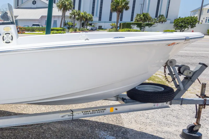 Slide: The Image of 2015 Sportsman Island Reef 17 Center Console boat on trailer, parked outdoors. - 35