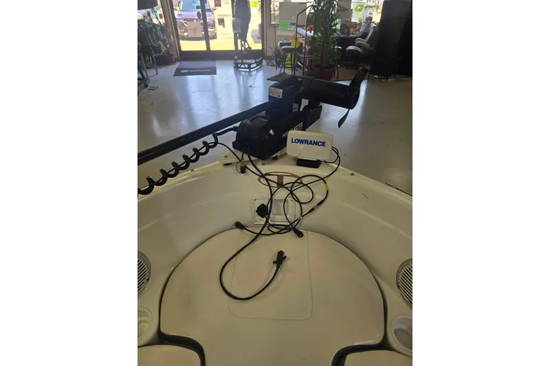 Slide: The Image of 2021 Tahoe 550 TF boat interior with Lowrance electronics and Minn Kota trolling motor. - 10