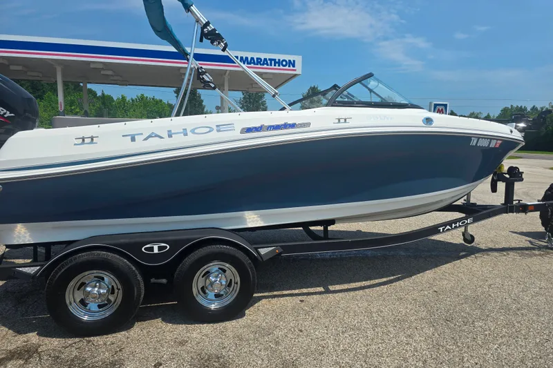 Slide: The Image of 2021 Tahoe 550 TF boat on trailer at a Marathon gas station. - 1