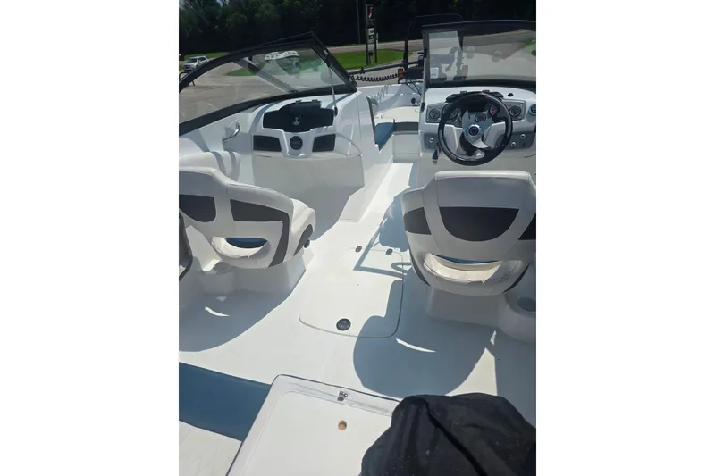 Slide: The Image of 2021 Tahoe 550 TF boat interior with steering wheel and seating. - 4