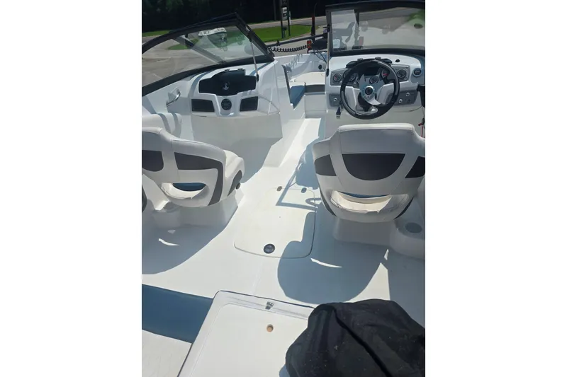 Slide: The Image of 2021 Tahoe 550 TF boat interior with steering wheel and seating. - 5