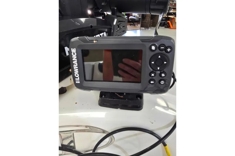Slide: The Image of Lowrance fish finder on 2021 Tahoe 550 TF boat dashboard. - 11