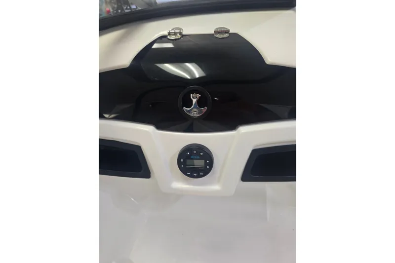 Slide: The Image of Dashboard of a 2021 Tahoe 550 TF boat with steering wheel and controls. - 9
