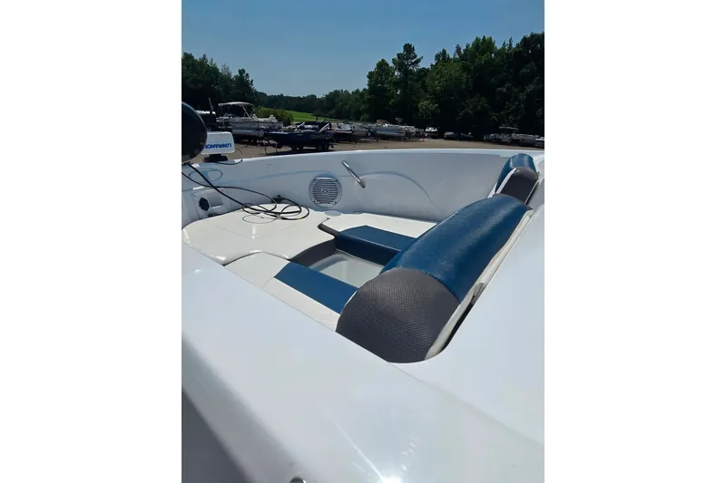 Slide: The Image of Interior view of a 2021 Tahoe 550 TF boat with blue and white seating. - 7