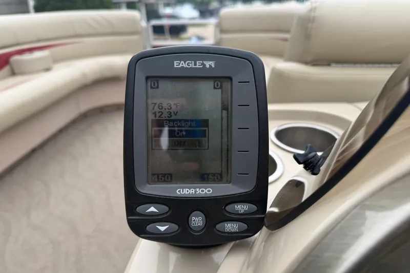 Slide: The Image of Fishfinder display on a 2011 Harris Cruiser 220 pontoon boat, showing temperature and voltage. - 10