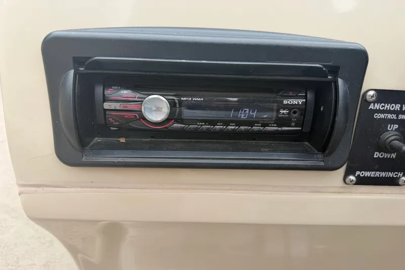 Slide: The Image of Sony stereo system on a 2011 Harris Cruiser 220 boat dashboard. - 9
