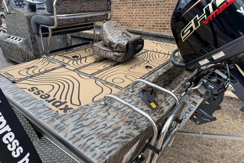 Slide: The Image of 2027 Xpress H20B Bay boat with camouflage design and powerful outboard motor. - 5