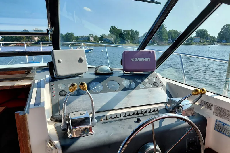 Slide: The Image of Cockpit view of a 1991 Tiara Yachts 3100 Open with Garmin navigation system. - 6
