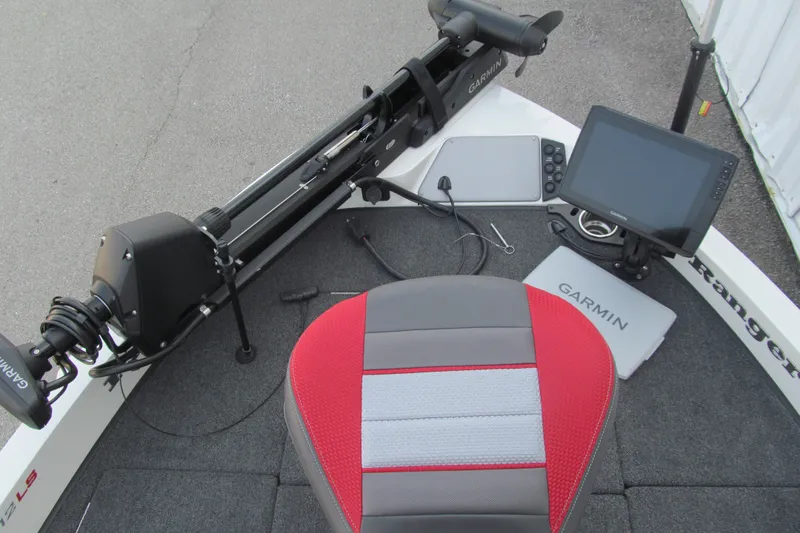 Slide: The Image of 2024 Ranger 212LS boat deck with Garmin electronics and red-gray seating. - 9