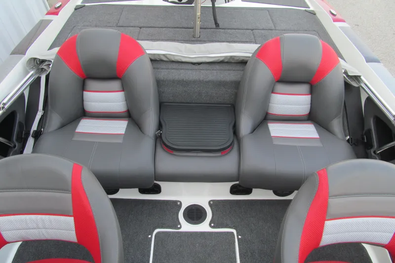 Slide: The Image of 2024 Ranger 212LS boat interior with gray and red seating. - 12