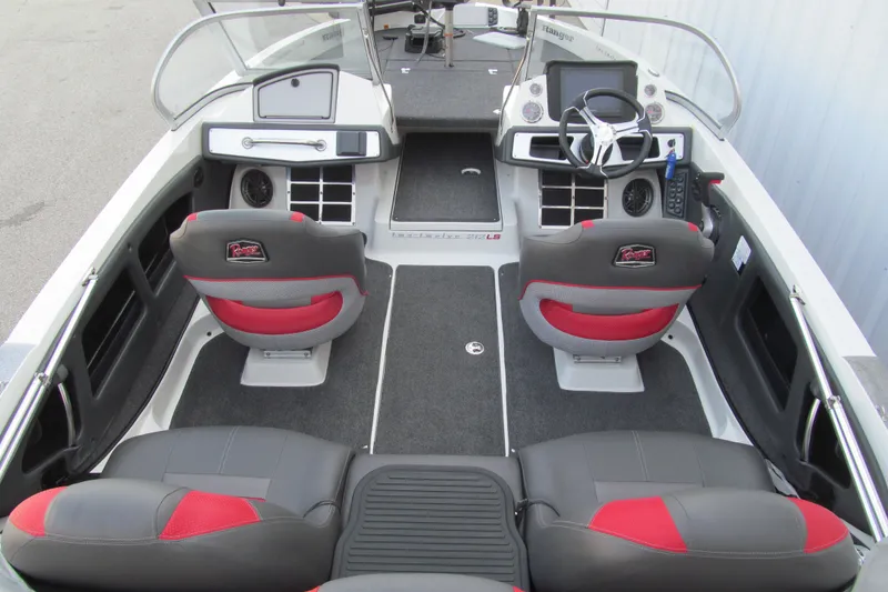 Slide: The Image of 2024 Ranger 212LS boat interior with dual seats, steering wheel, and dashboard controls. - 5