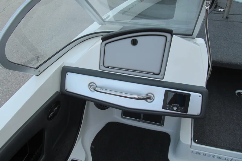 Slide: The Image of 2024 Ranger 212LS boat dashboard with JL Audio system and storage compartment. - 7