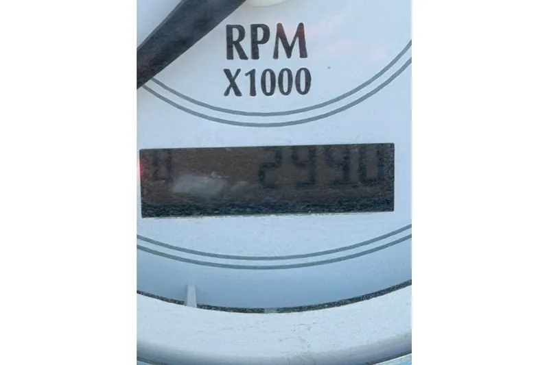 Slide: The Image of RPM gauge displaying 2490 for 2005 Regal 2200 Bowrider boat. - 14