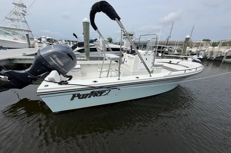 The Image of 2024 Parker 1801 Center Console boat docked with Yamaha outboard motor. - 0