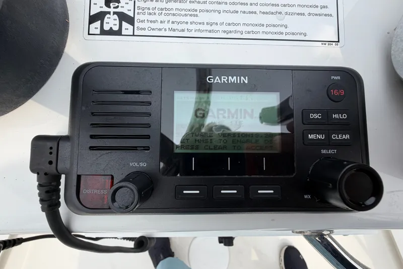 Slide: The Image of Garmin marine radio on 2024 Parker 1801 Center Console boat dashboard. - 16