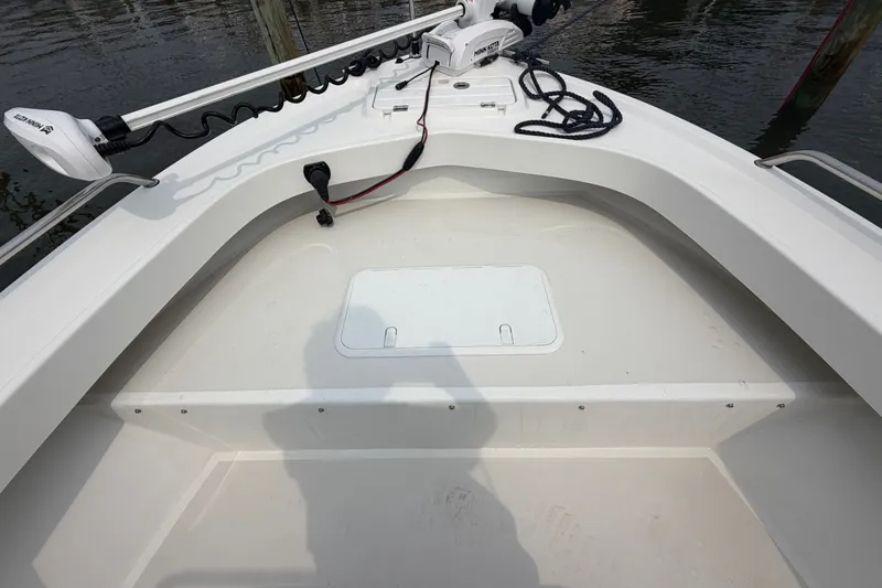 Slide: The Image of 2024 Parker 1801 Center Console boat bow with trolling motor and storage hatch. - 7