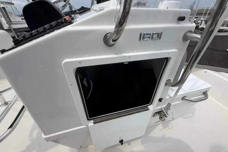 Slide: The Image of 2024 Parker 1801 Center Console boat dashboard with storage compartment. - 11