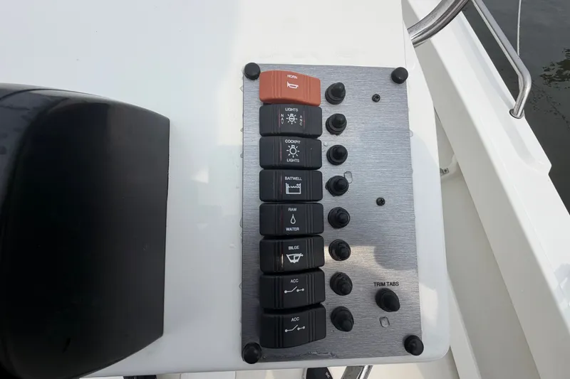 Slide: The Image of Control panel of 2024 Parker 1801 Center Console boat with labeled switches and buttons. - 17
