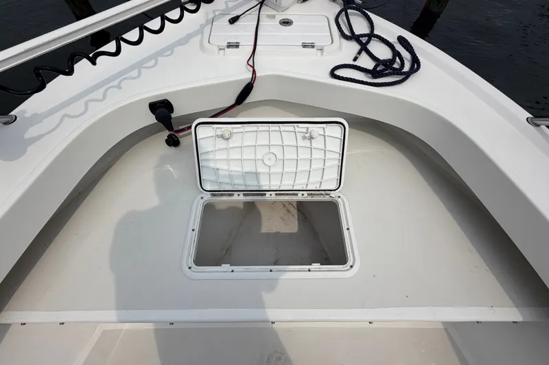 Slide: The Image of 2024 Parker 1801 Center Console boat with open storage compartment on deck. - 8