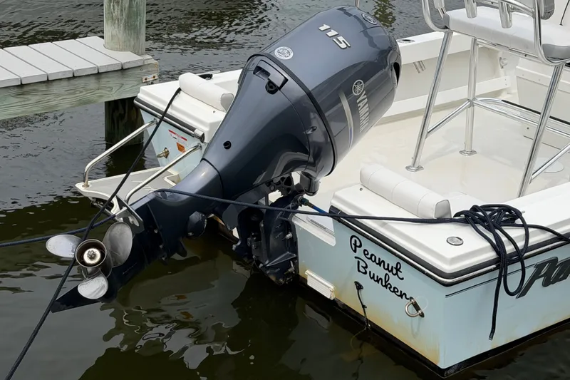Slide: The Image of 2024 Parker 1801 Center Console boat with Yamaha 115 outboard motor docked. - 25