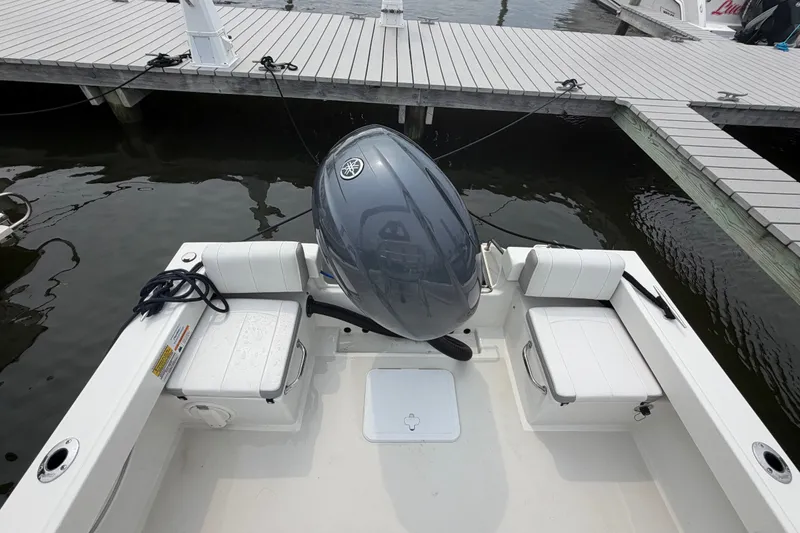Slide: The Image of 2024 Parker 1801 Center Console boat docked with outboard motor. - 21