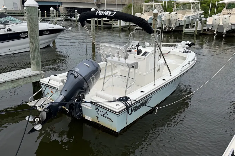 Slide: The Image of 2024 Parker 1801 Center Console boat docked with Yamaha outboard motor. - 3