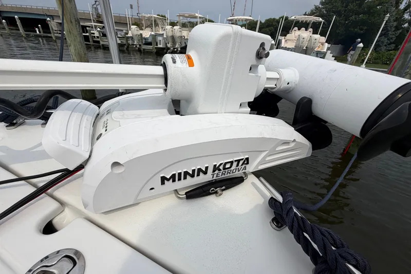 Slide: The Image of Minn Kota Terrova motor on 2024 Parker 1801 Center Console boat at dock. - 4