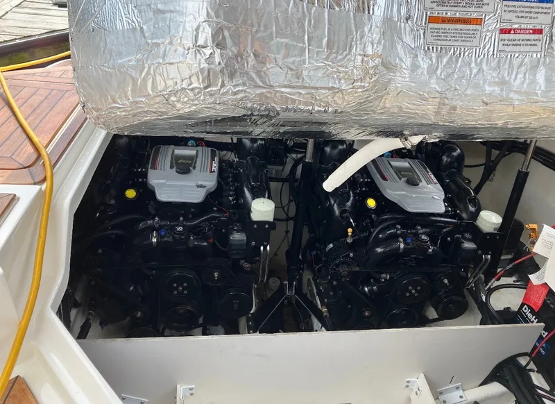 Slide: The Image of The engine compartment of a 2015 Sea Ray SLX 350 features two powerful engines. - 10