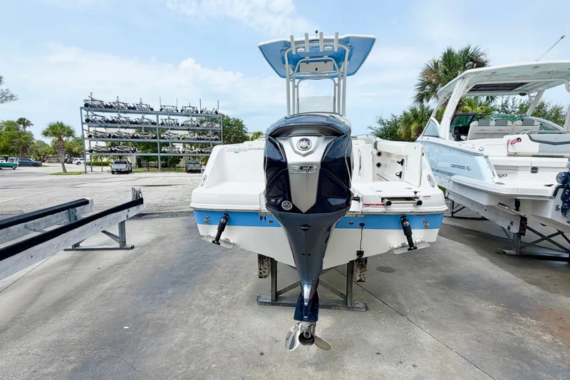 Slide: The Image of 2024 Robalo R222 Center Console boat with Yamaha engine, parked outdoors. - 4