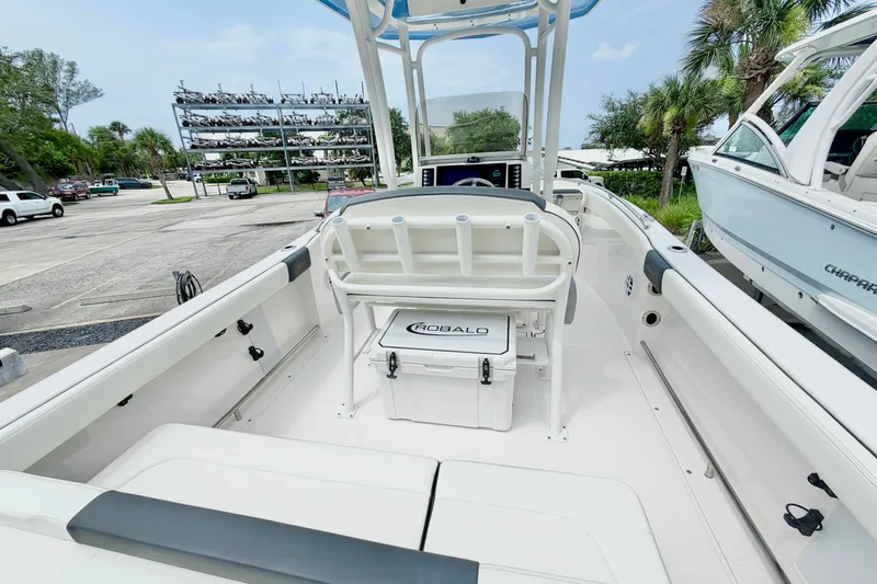Slide: The Image of 2024 Robalo R222 Center Console boat interior with seating and storage. - 9