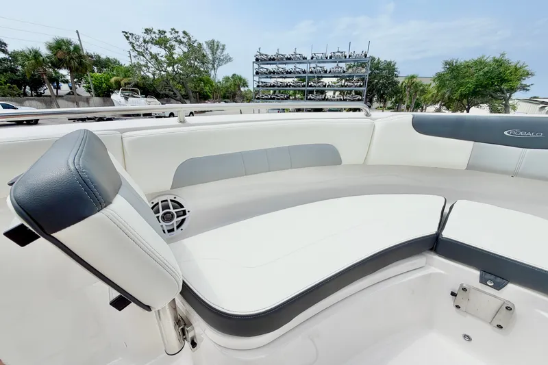 Slide: The Image of 2024 Robalo R222 Center Console boat interior with cushioned seating and speaker. - 27