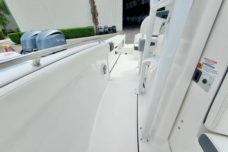 Slide: The Image of 2024 Robalo R222 Center Console boat interior with Yamaha engines, showcasing sleek design and functionality. - 19