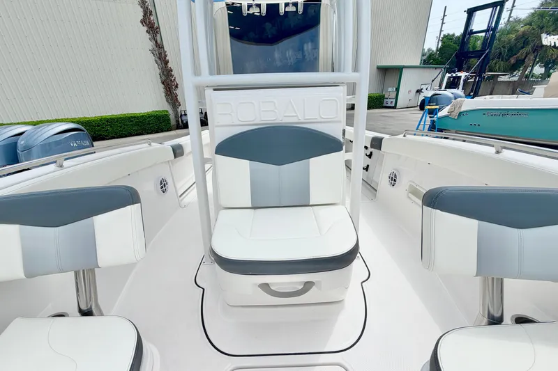Slide: The Image of 2024 Robalo R222 Center Console boat interior with cushioned seating and sleek design. - 22
