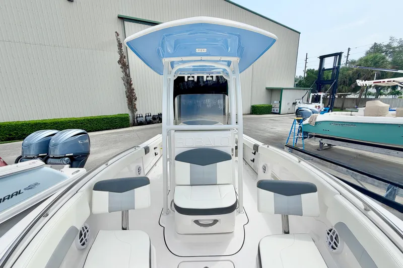 Slide: The Image of 2024 Robalo R222 Center Console boat with seating and dual Yamaha engines. - 24