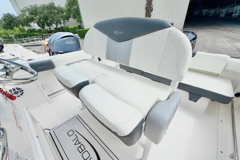 Slide: The Image of 2024 Robalo R222 Center Console boat interior with cushioned seating and Yamaha engine. - 15