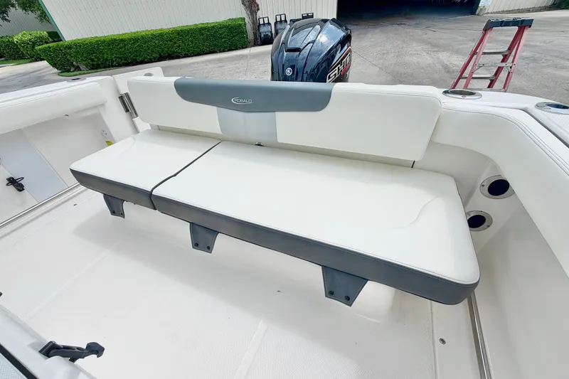 Slide: The Image of 2024 Robalo R222 Center Console boat with white seating and Yamaha outboard motor. - 12