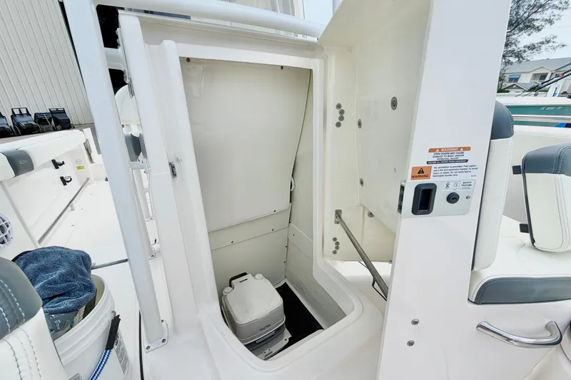 Slide: The Image of 2024 Robalo R222 Center Console boat interior storage compartment. - 23