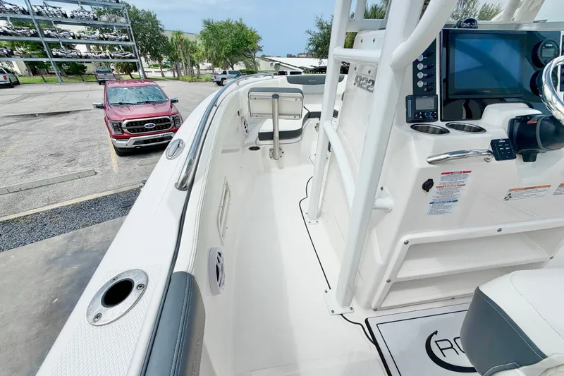 Slide: The Image of 2024 Robalo R222 Center Console boat interior with navigation system and seating. - 18
