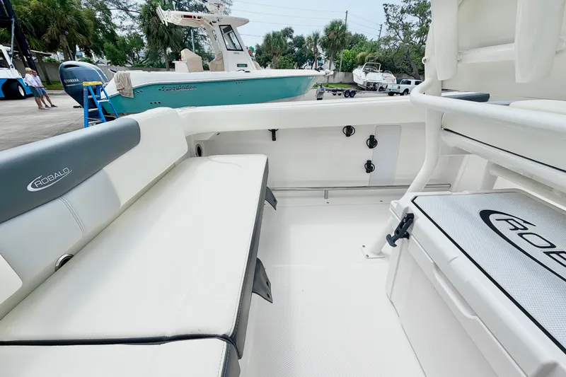 Slide: The Image of 2024 Robalo R222 Center Console boat interior with seating and storage. - 13