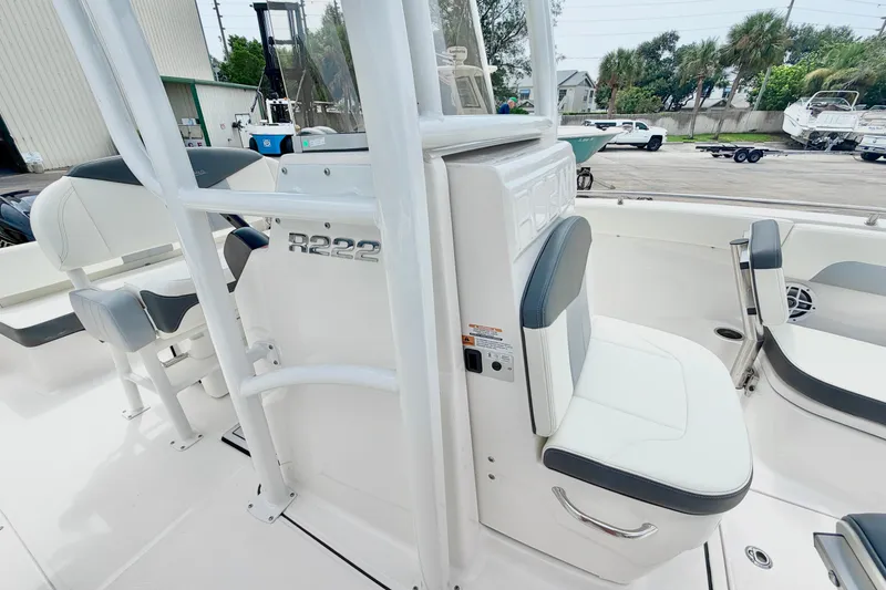Slide: The Image of 2024 Robalo R222 Center Console boat interior with seating and console details. - 21