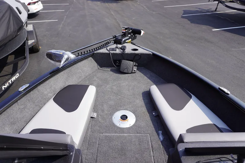 Slide: The Image of 2027 Tracker Pro Guide V-175 Combo boat interior with seating and trolling motor. - 7