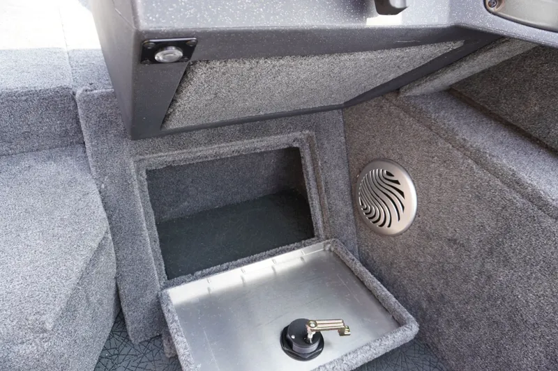 Slide: The Image of 2027 Tracker Pro Guide V-175 Combo boat interior storage compartment with speaker. - 9